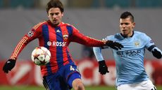Georgi Schennikov of PFC CSKA Moscow challenged by Sergio Aguero of Manchester City 
