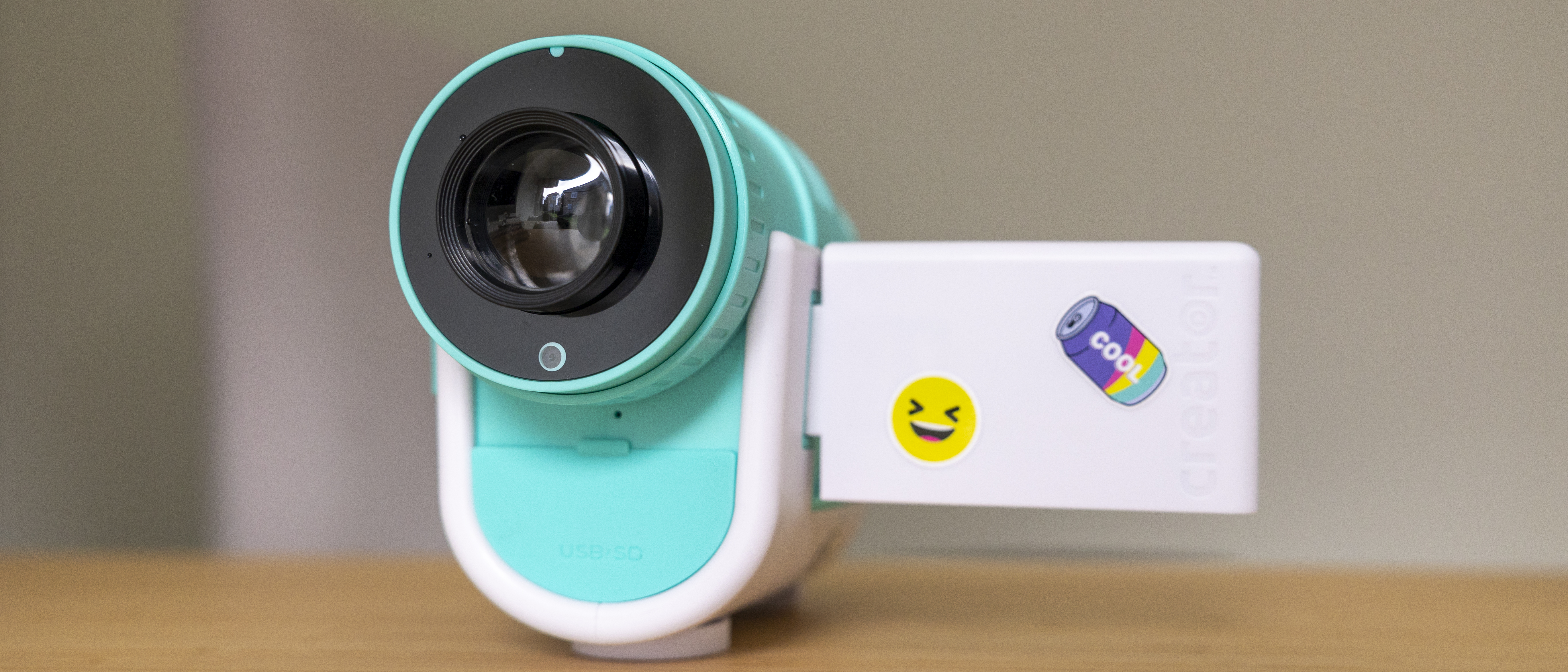 The Photo Creator projector video camera being handled in a home office