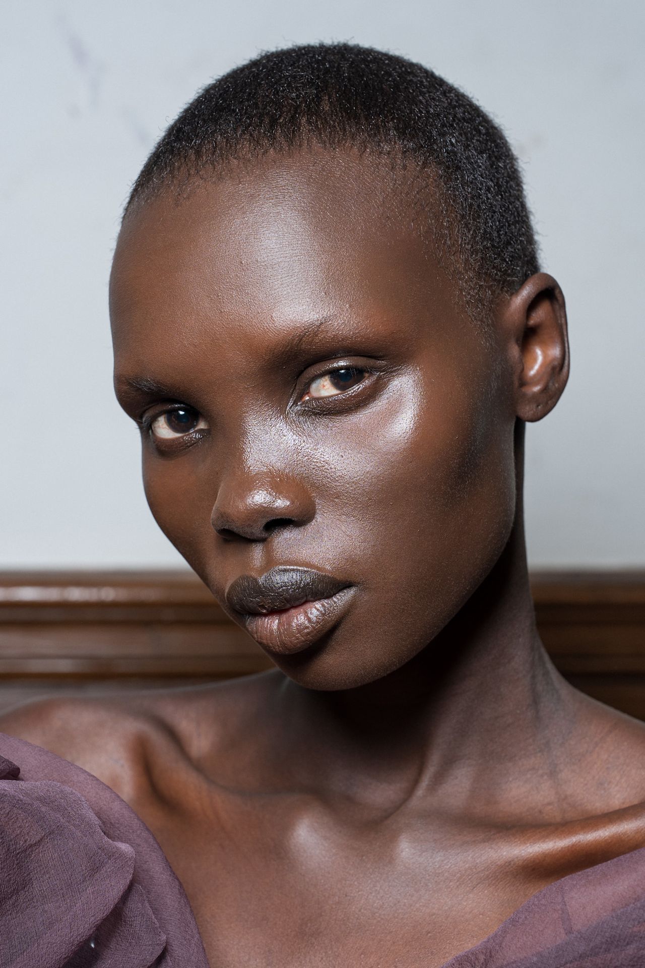 Three women with bronzed makeup