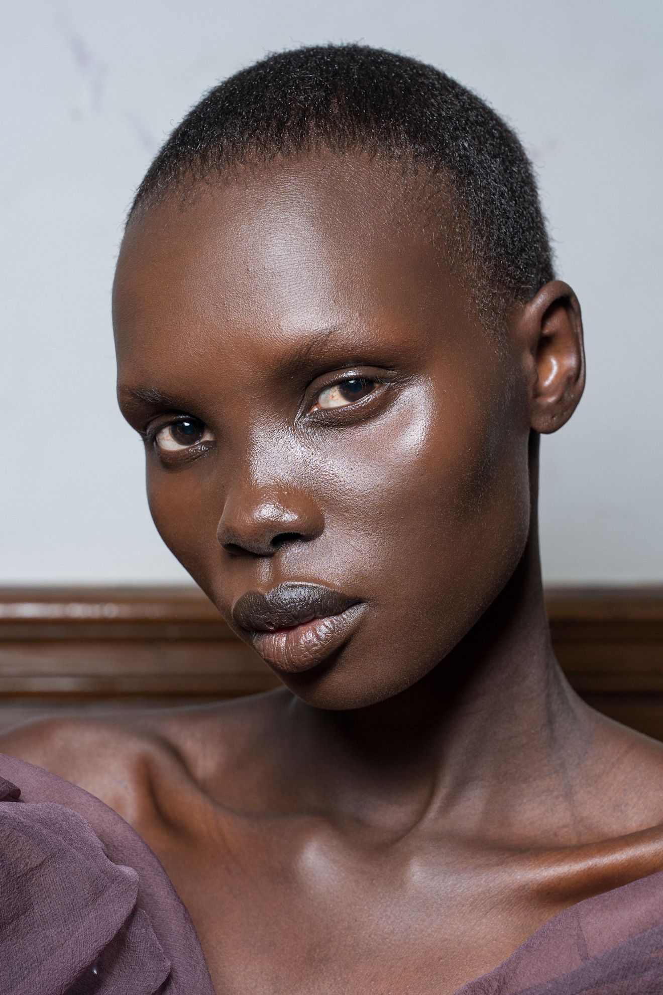 Three women with bronzed makeup