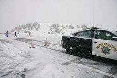 California Highway Patrol blocks the road following a storm. 