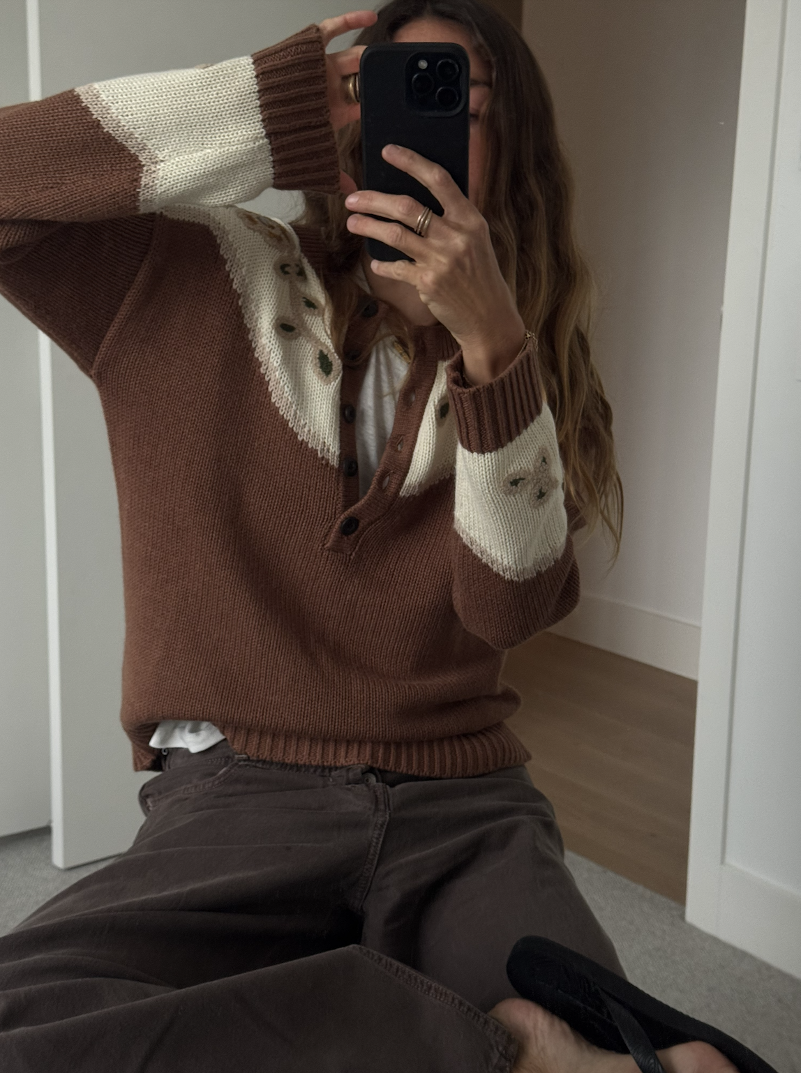 Angie wears a Free People sweater