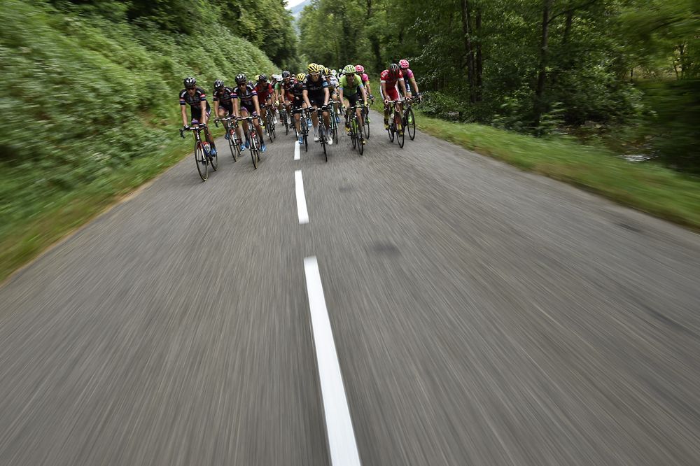 The peloton spreads across the road during stage 12.