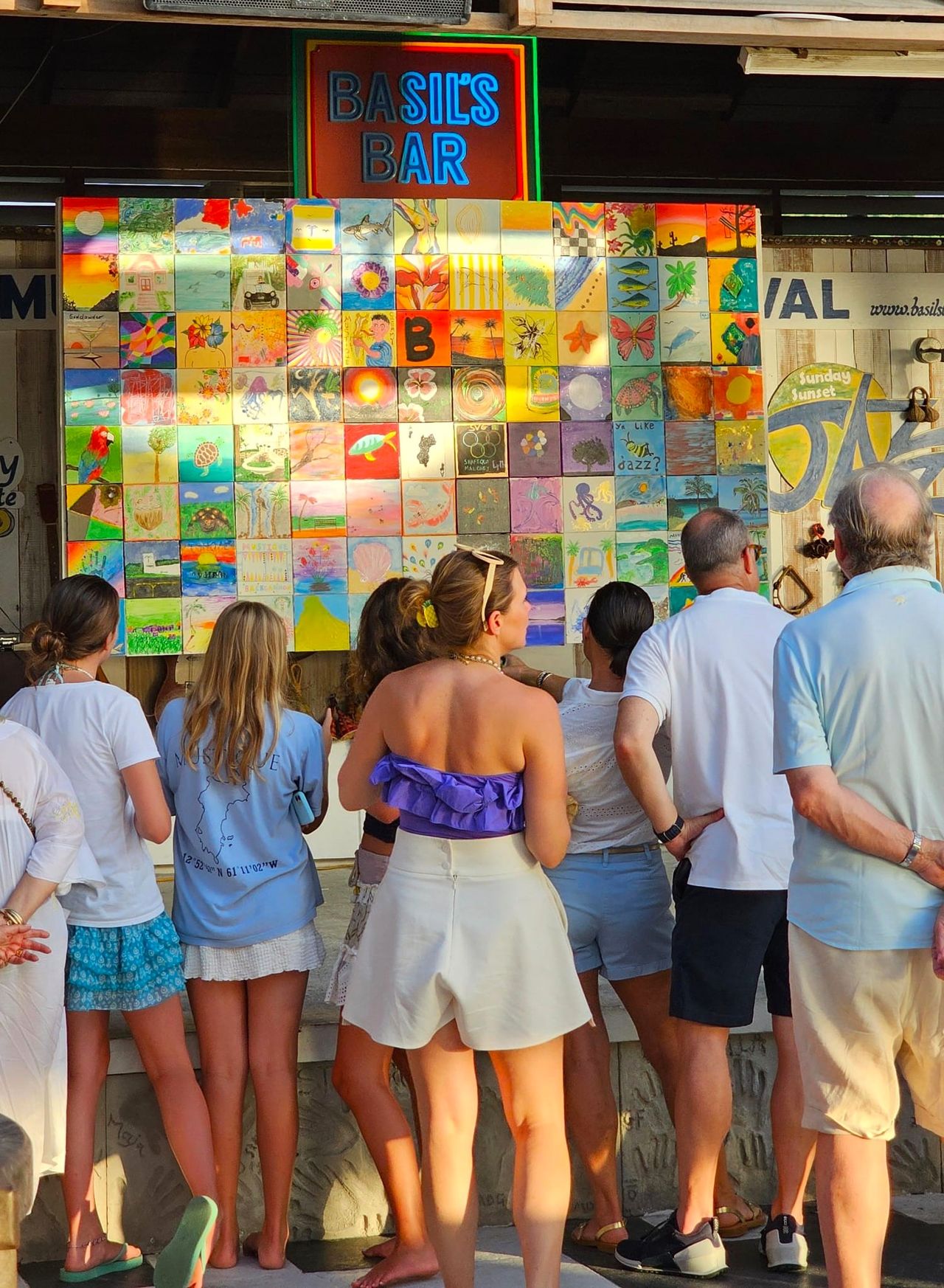 Photographs of paintings done by Mustique guests