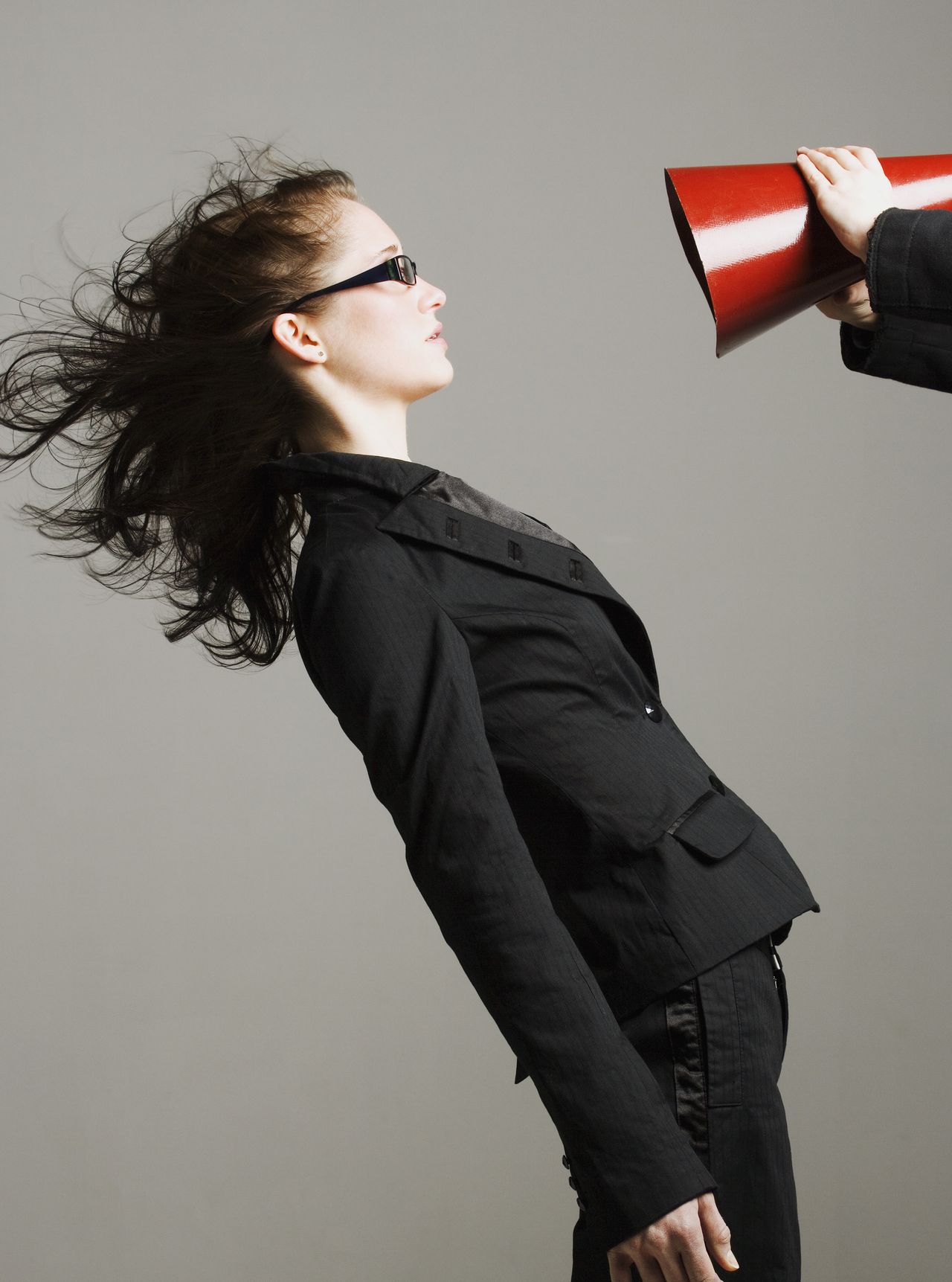 Woman being shouted at through megaphone