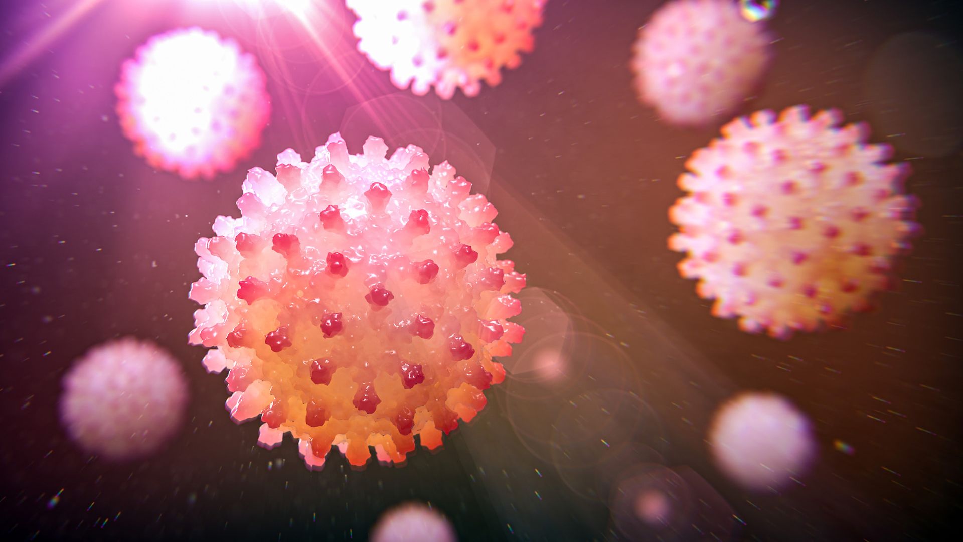 A series of pink spiky balls against a purple background