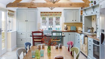 kitchen with wooden worktop and white fixtures