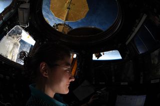 NASA astronaut Christina Koch is pictured inside the Cupola observatory at the International Space Station.