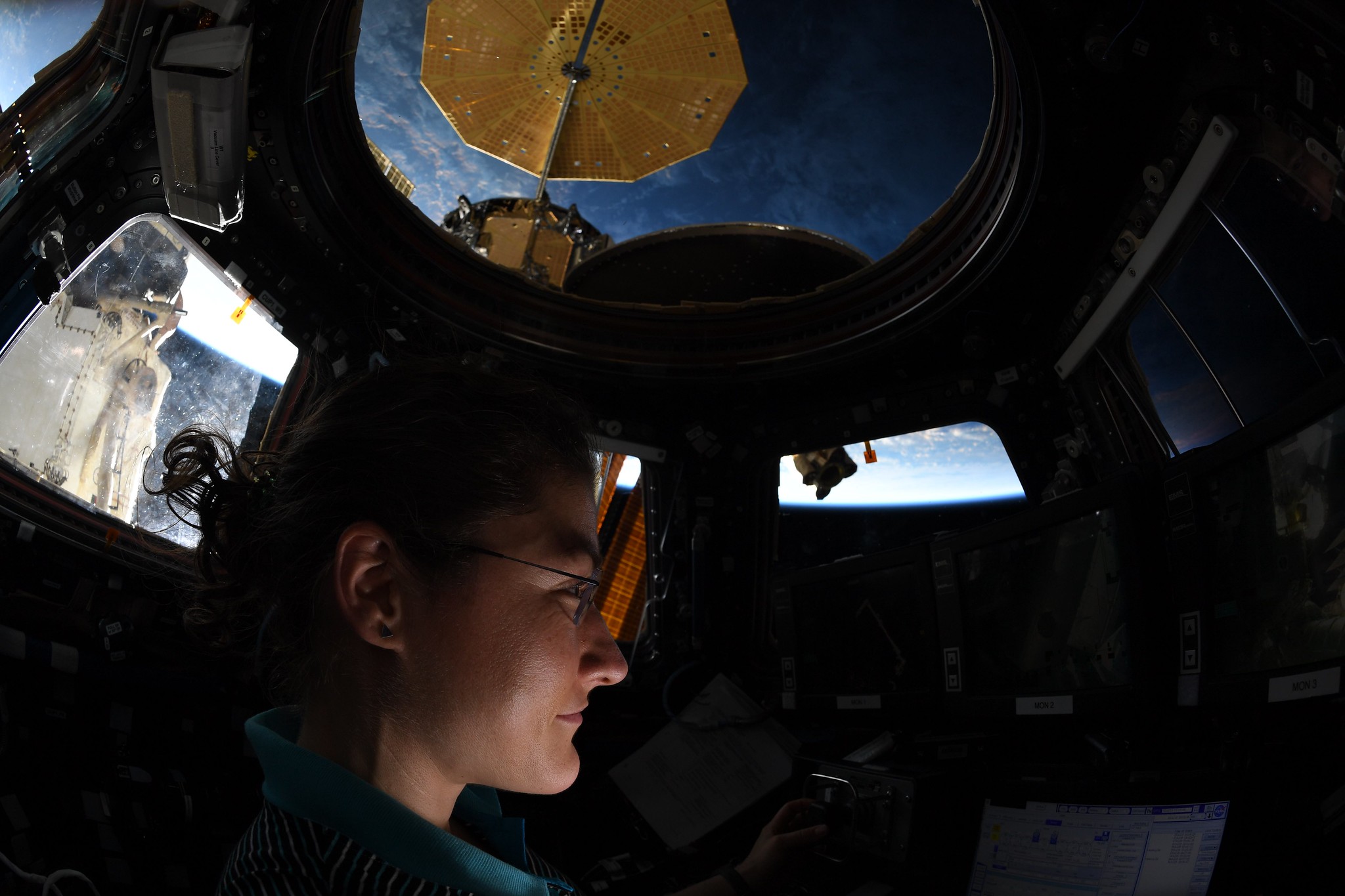 NASA astronaut Christina Koch is pictured inside the Cupola observatory at the International Space Station. 