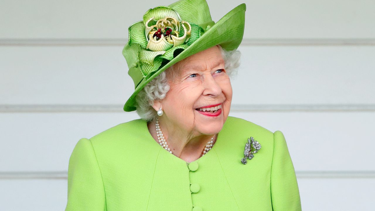 Queen Elizabeth II wearing a lime green hat and dress coat