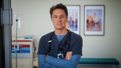 J.D. smiling while folding his arms in Scrubs season 10 episode 6