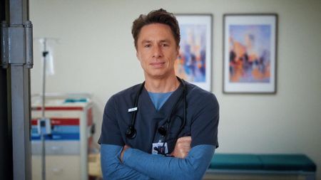 J.D. smiling while folding his arms in Scrubs season 10 episode 6