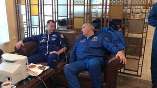 Astronaut Nick Hague and Roscosmos leader Dmitry Rogozin are shown in a photograph taken after the Soyuz capsule's launch abort on Oct. 11, 2018.