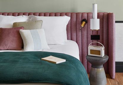 a bedroom with a radio next to the bed 