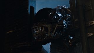 Aliens (1986)_Twentieth Century Fox - Xenomorph forcing its way through a door.