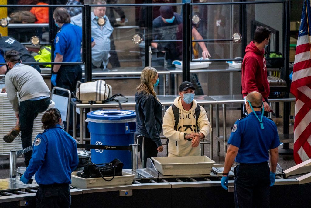 A traveler going through airport security.