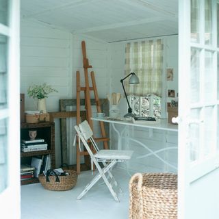 blue shed with table and baskets