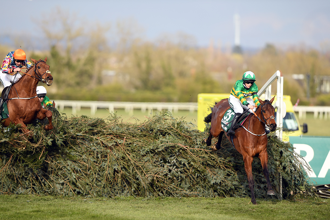 The Randox Grand National. Aintree Minella Times (right) 1st jumps the last to win the National and sweeps Rachel Blackmore into the reord book. Balko Des Flos (left) 2nd Pic Bill Selwyn 10-4-21