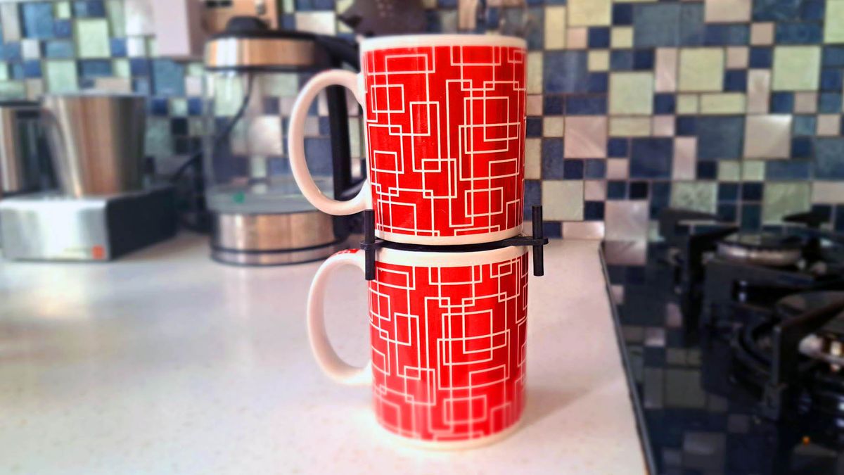 Two red and white mugs stacked