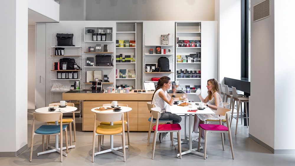 The cafe channels the clean aesthetics of the Moleskine notebooks