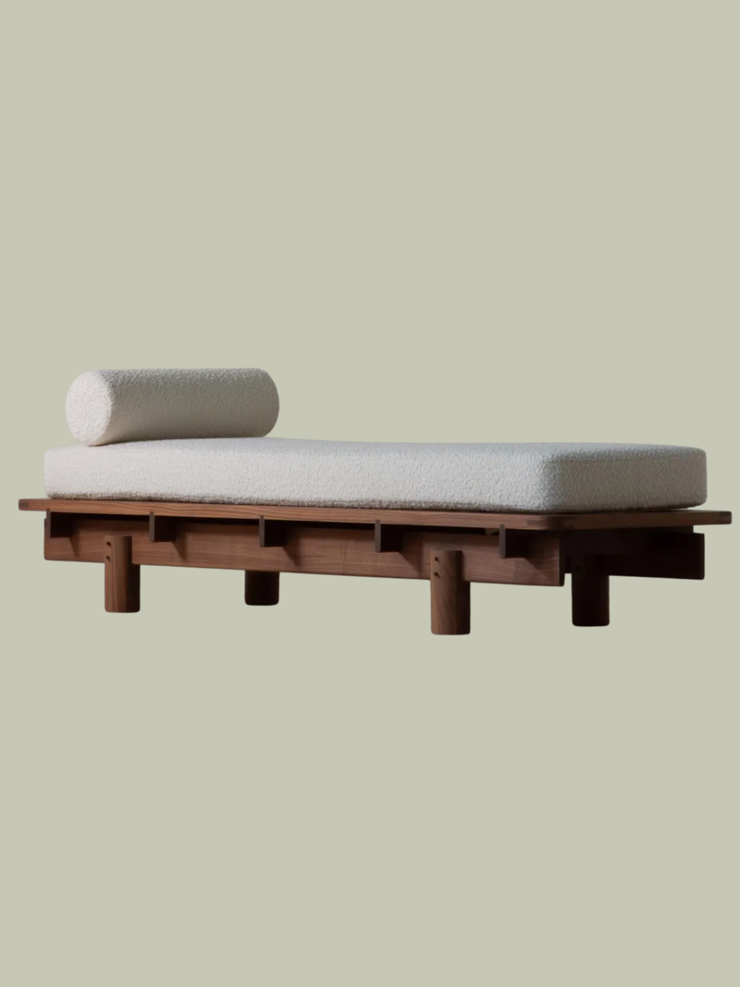 A walnut daybed with a textured cushion from Konk