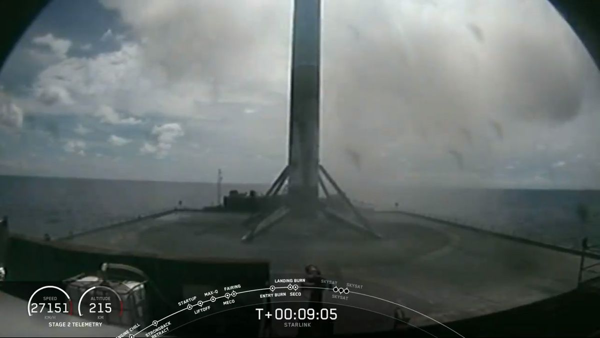A SpaceX Falcon 9 rocket first-stage booster on the the drone ship Of Course I Still Love You in the Atlantic Ocean after successfully launching 58 Starlink internet satellites and three Planet SkySats from Cape Canaveral Air Force Station, Florida on Aug. 18, 2020.