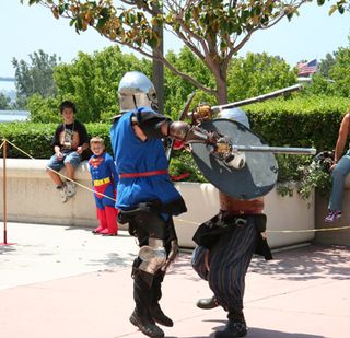 Two Comic-Con attendees battle it out in a friendly game of