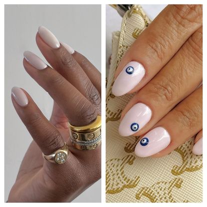 two hands with white manicures wearing gold rings