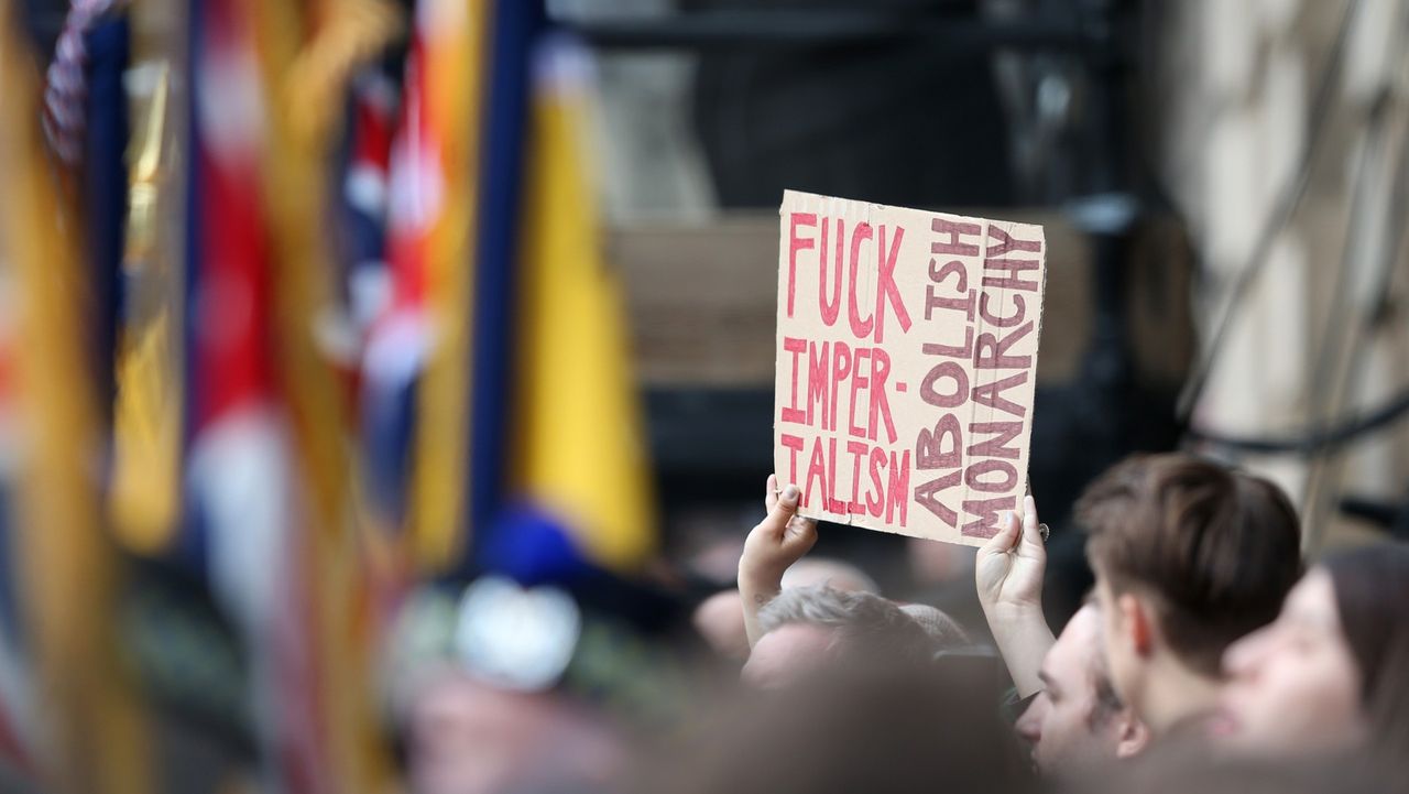 Anti-Royalists hold up a placard in protest at King Charles&amp;#039; Proclamation ceremony in Edinburgh