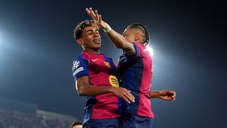 Lamine Yamal of FC Barcelona (L) celebrates scoring his team's fourth goal with teammate Raphinha (R) during the UEFA Champions League 2024/25 Quarter Final First Leg match between FC Barcelona and Borussia Dortmund at Estadi Olimpic Lluis Companys on April 09, 2025 in Barcelona, Spain.