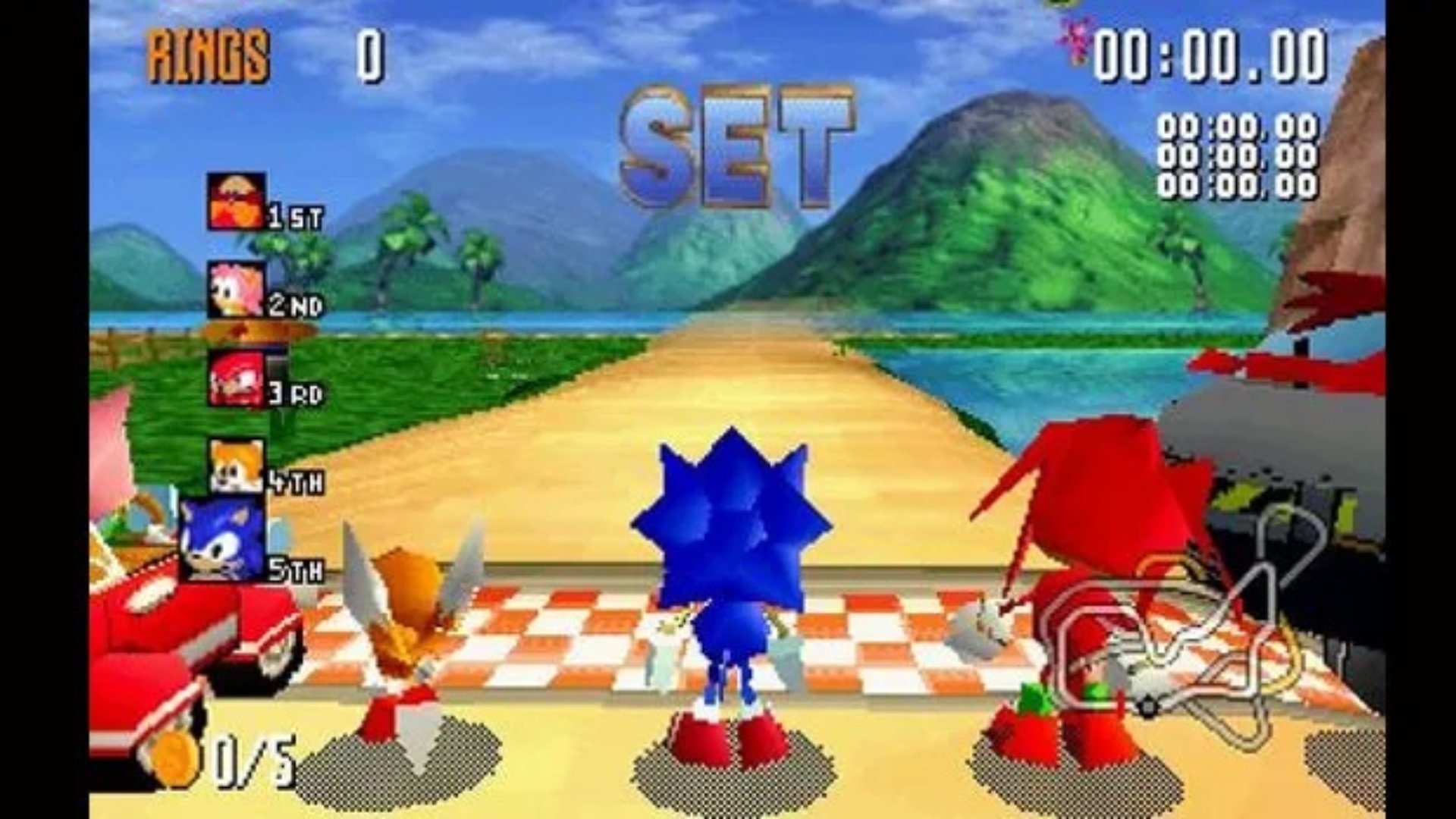 Sonic R screenshot showing Tails, Sonic, Knuckles, Amy, and Dr Robotnik lined up at the starting line for a race