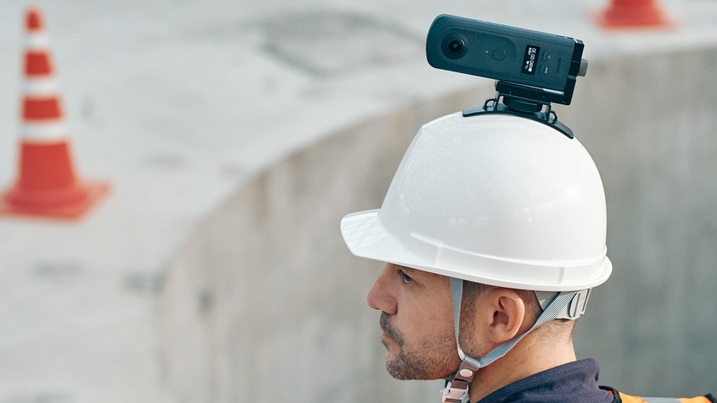 Ricoh Theta A1 on helmet of construction worker