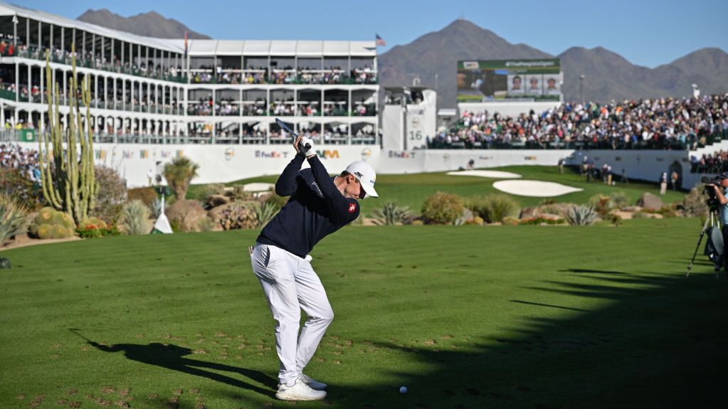 Matt Fitzpatrick takes a shot on the 16th whole during the 2024 Waste Management Phoenix Open