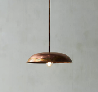 Industrial pendant light with copper finish.