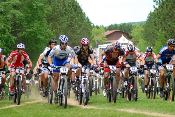 The BelGioioso Elite Series men, including Brian Matter (4), Mike Phillips (41), and Brian Eppen (70), faced a long section of winding, gravel fire road before the singletrack