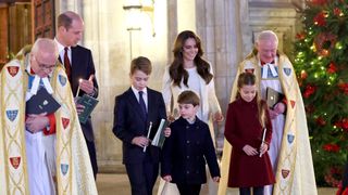 Catherine, Princess of Wales, Prince Louis of Wales, Princess Charlotte of Wales, Prince William, Prince of Wales and Prince George of Wales process out of The "Together At Christmas" Carol Service