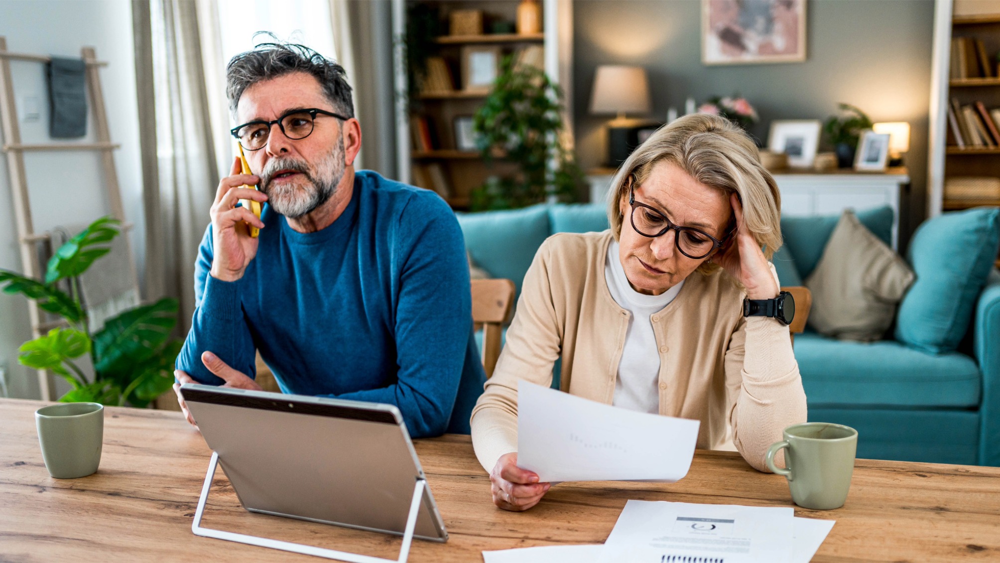 Mature couple stressed about finances and bills