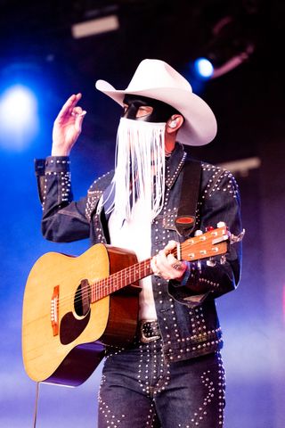 Best Coachella Fashion Looks | Singer Orville Peck performs on the Gobi Stage during Weekend 2, day 3 of the 2022 Coachella Valley Music & Arts Festival on April 24, 2022 in Indio, California.