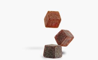Three coffee cubes falling with white background