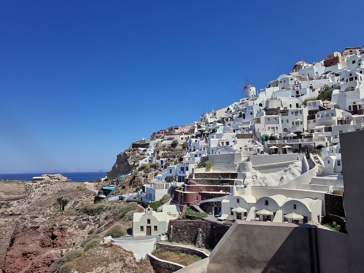 Test shots taken on the L'Atitude 52 smart glasses showing the cliffs of Santorini