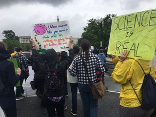 This sign, inspired by Dr. Seuss, calls on the Trump administration to pay attention to and care about science.