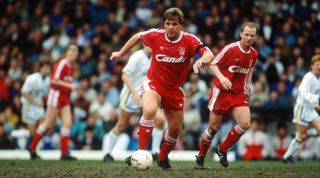 Jan Molby of Liverpool runs with the ball in a game against Leeds United in April 1991.