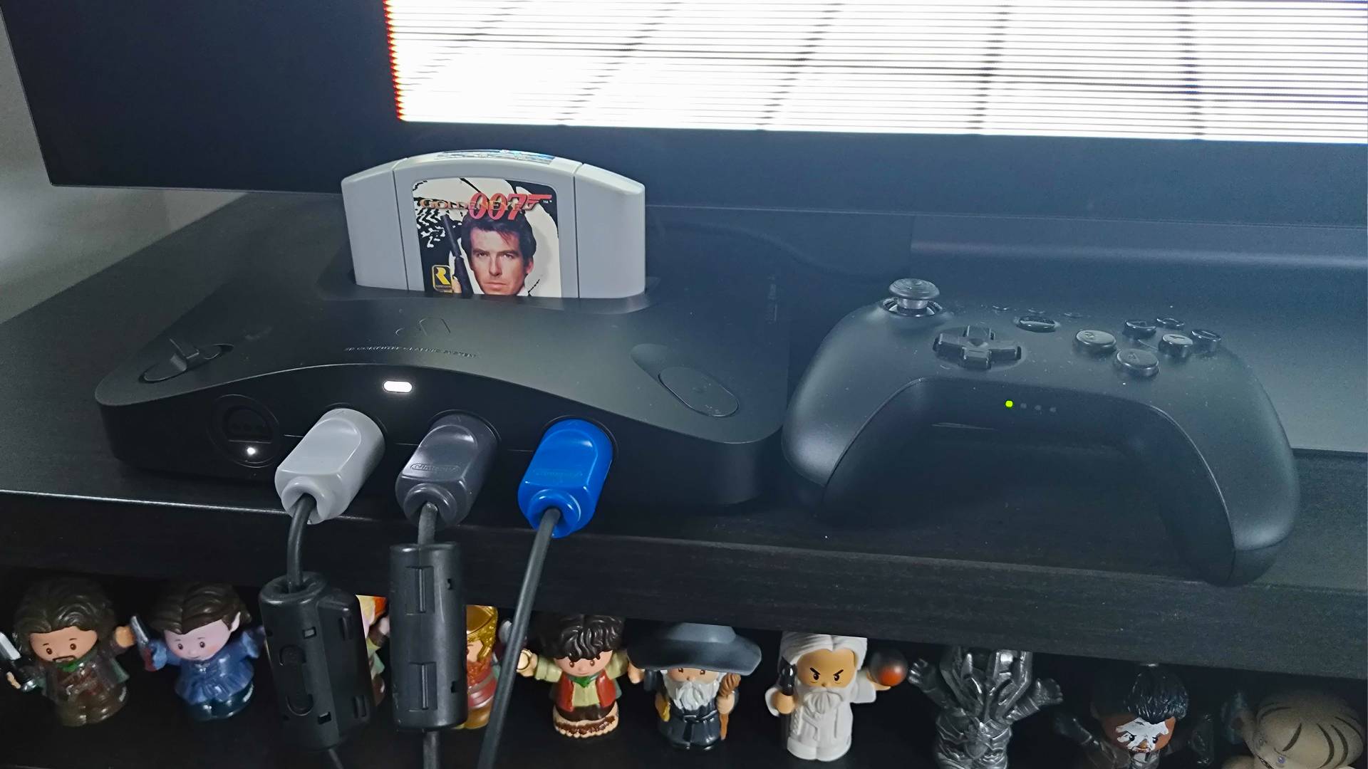 Analogue 3D with Goldeneye cartridge inserted next to 8Bitdo controller and three original pads inserted into ports.