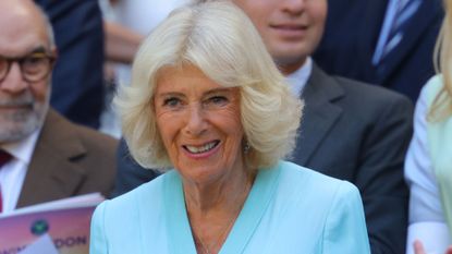 Queen Camilla takes her seat in the royal box on day ten of The Championships Wimbledon 2026