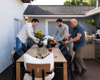 laurence fishburne and the property brothers putting together an outdoor living room for celebrity IOU