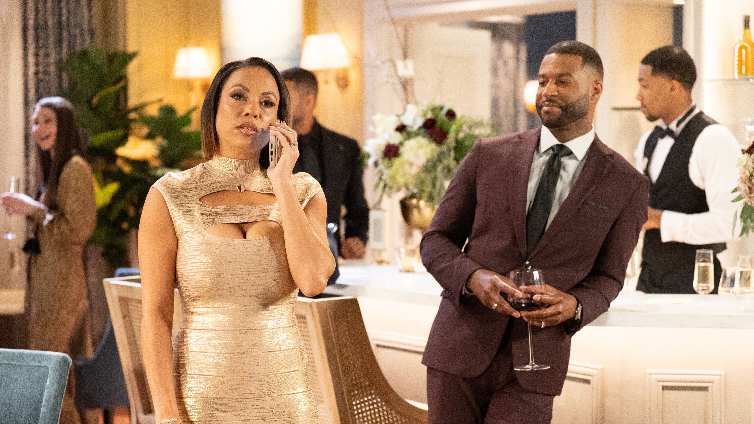 Daphnee Duplaix as Nicole Dupree Richardson and Robert Christopher Riley as Carlton at Ted and Nicole's anniversary party in Beyond the Gates