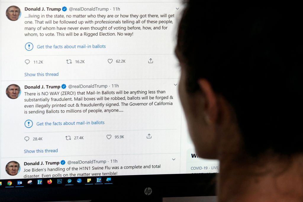 A person looks at Trump&amp;#039;s tweets on a computer screen.