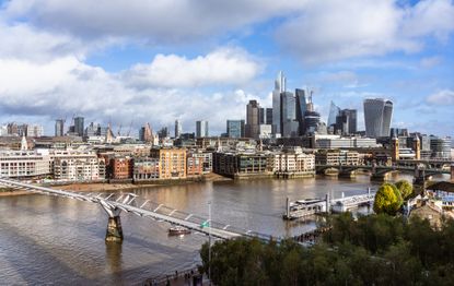 Sunny aerial view of Millennium Bridge and City of London