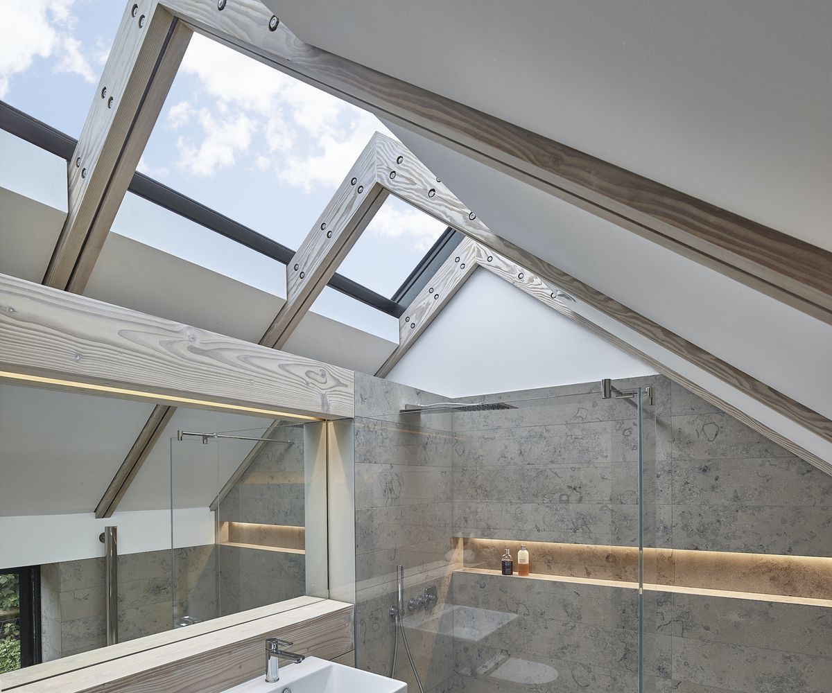 Pitched roof loft extension with built in lights in a 2nd floor bathroom