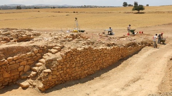 Mold-made mud bricks making up an ancient dilapidated wall.